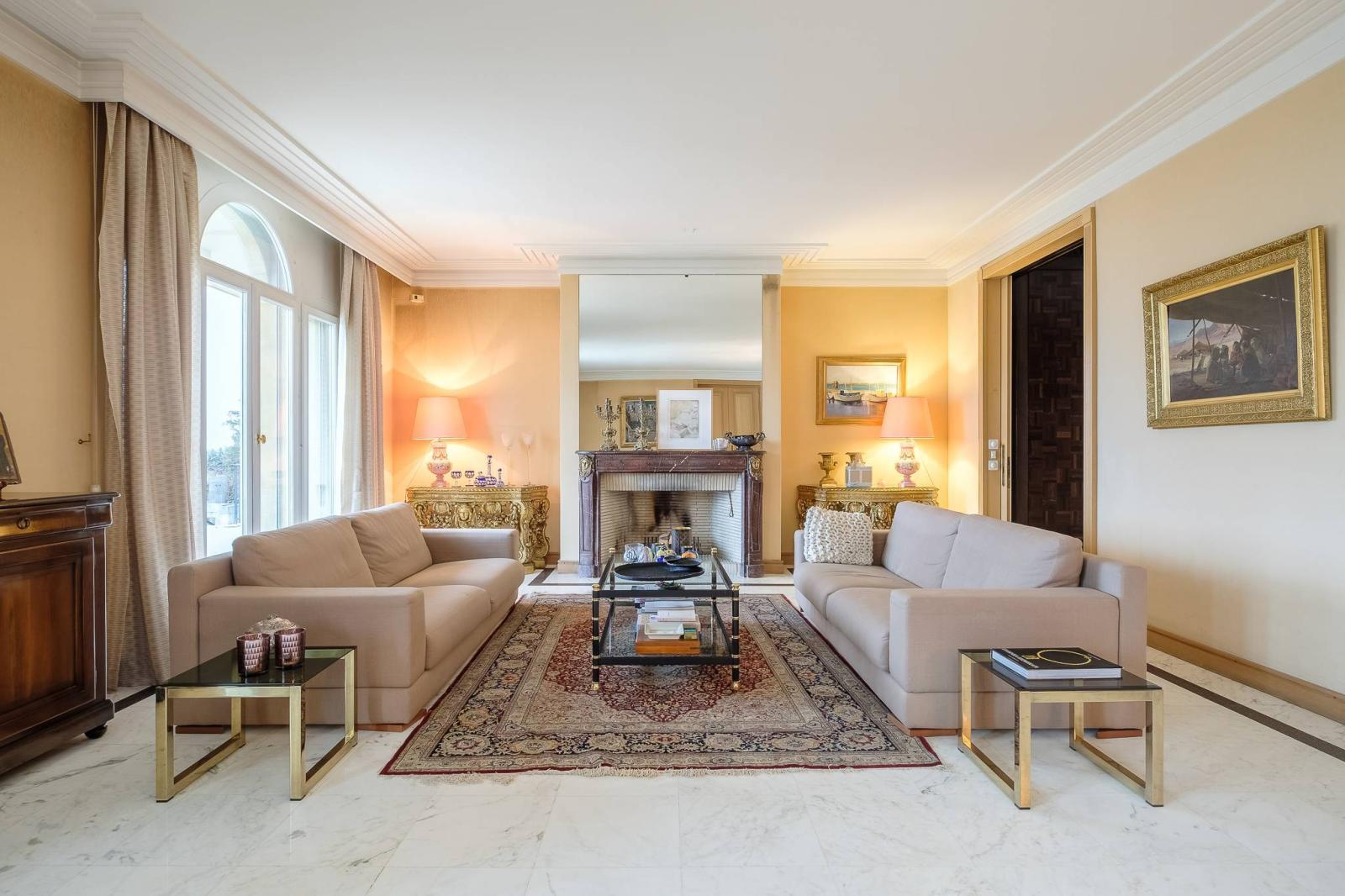 Spacious manor house divided into two residences, offering stunning lake views.