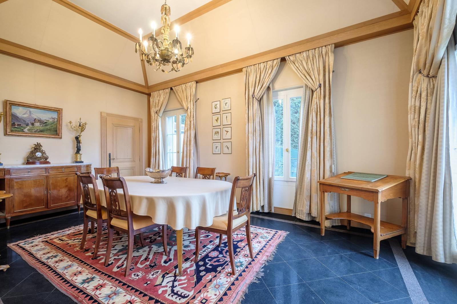 Spacious manor house divided into two residences, offering stunning lake views.