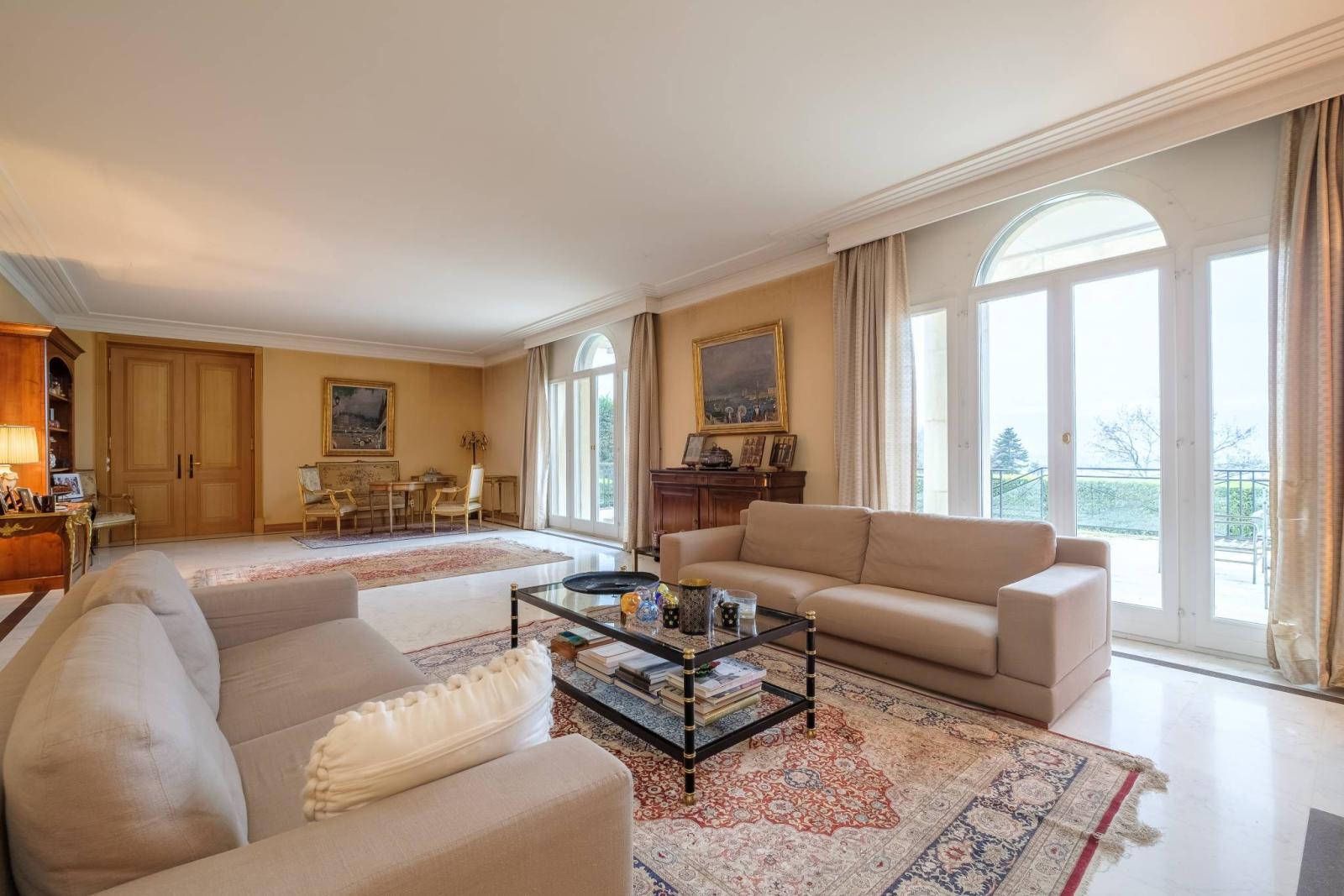 Spacious manor house divided into two residences, offering stunning lake views.